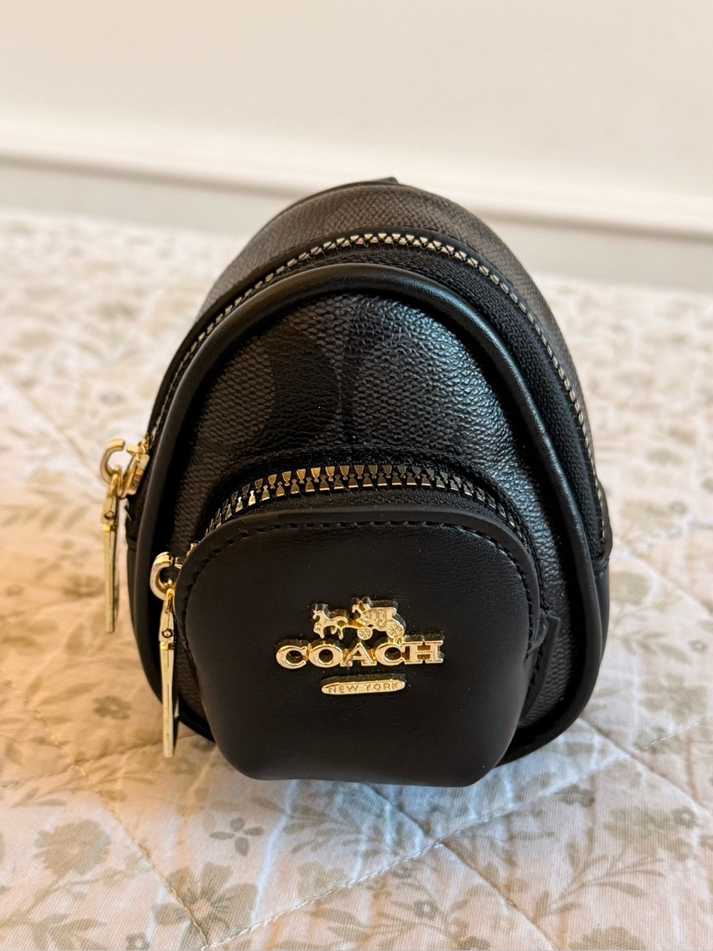 Coach mini court backpack bag charm in black with gold hardware